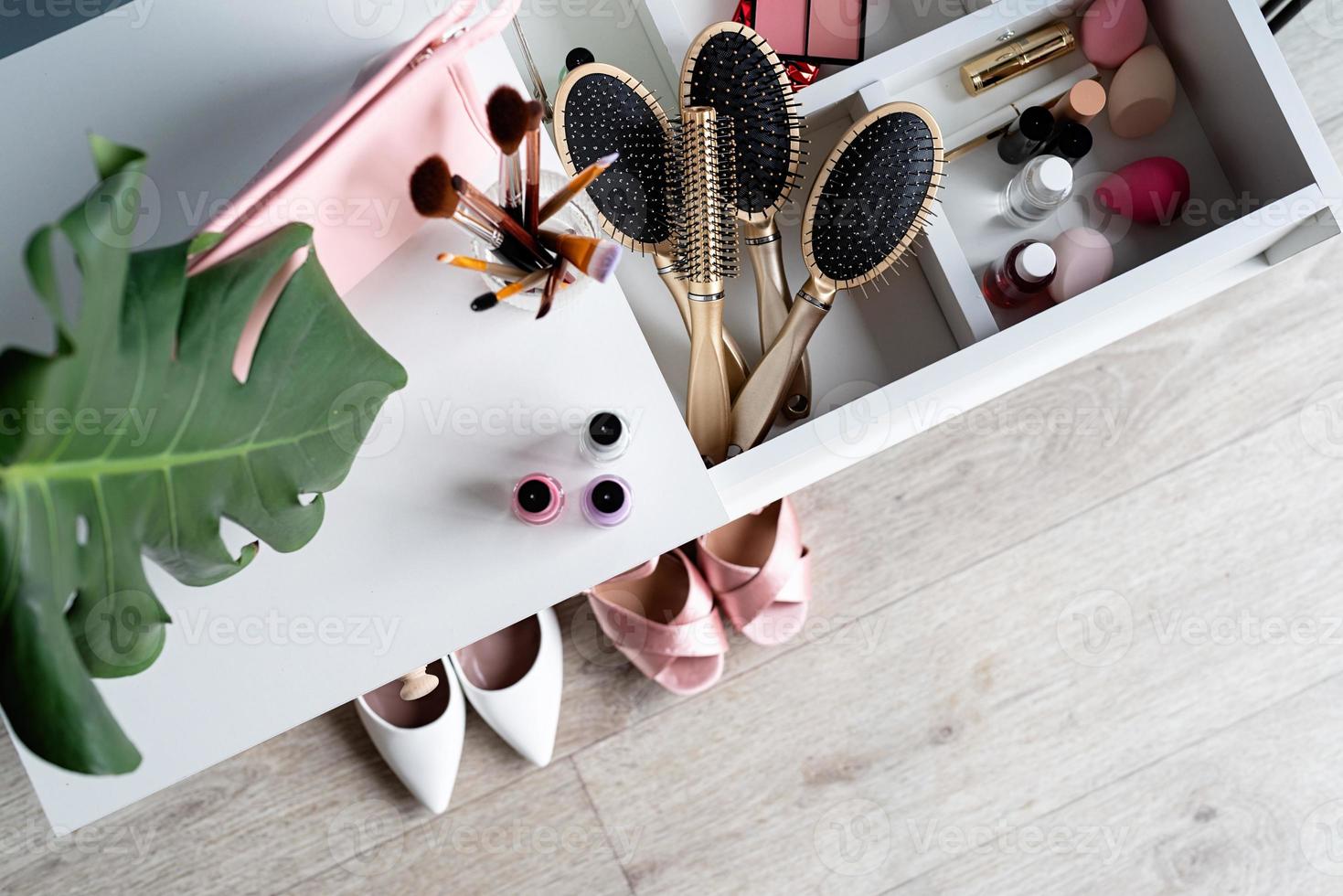 Stylish room interior with elegant dressing table and plants photo