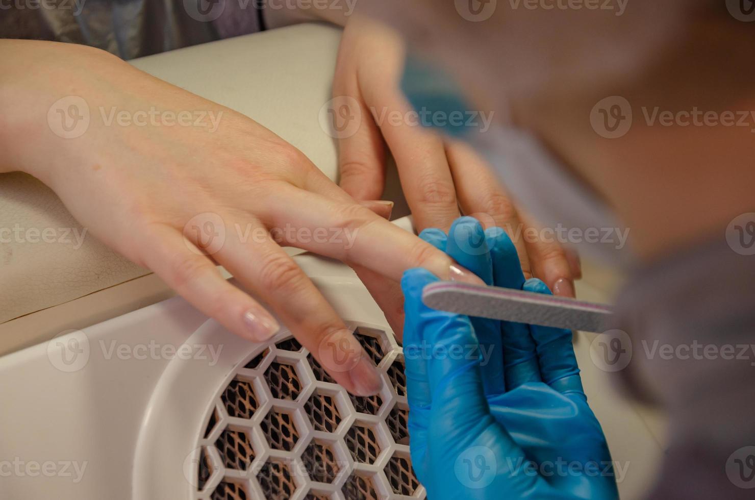 manicure, nails file with a file. photo