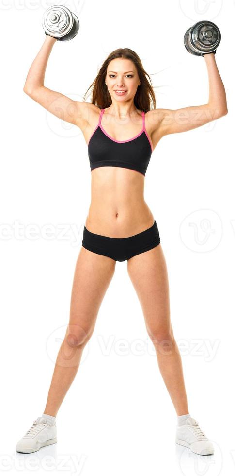 Happy athletic woman with dumbbells doing sport exercise, isolated on white photo