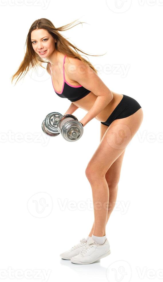 Happy athletic woman with dumbbells doing sport exercise, isolated on white photo