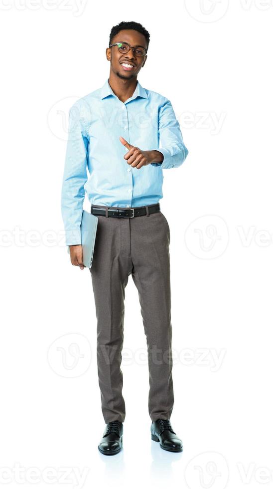 Happy african american college student standing with laptop and finger up on white photo