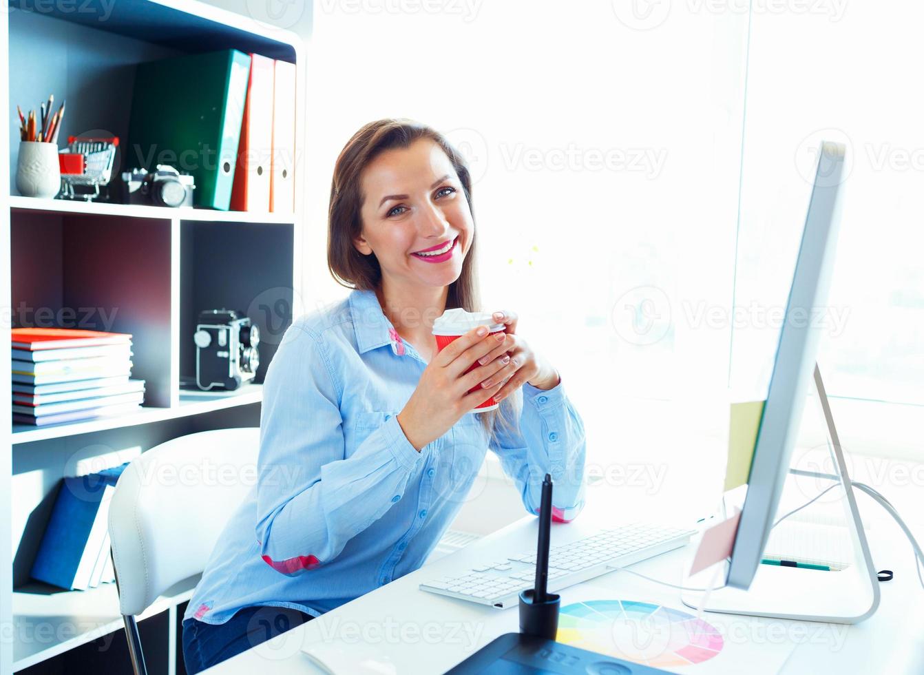 Beautiful business woman working at the home office photo