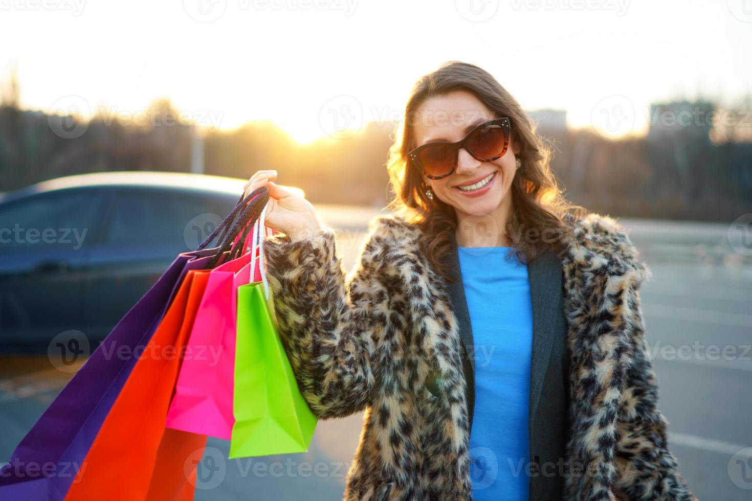 Woman holding her shopping bags in her hand photo