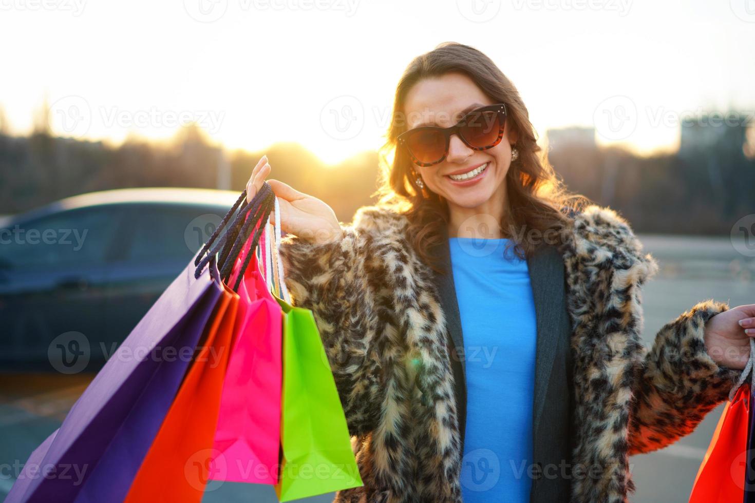 Woman holding her shopping bags in her hand photo