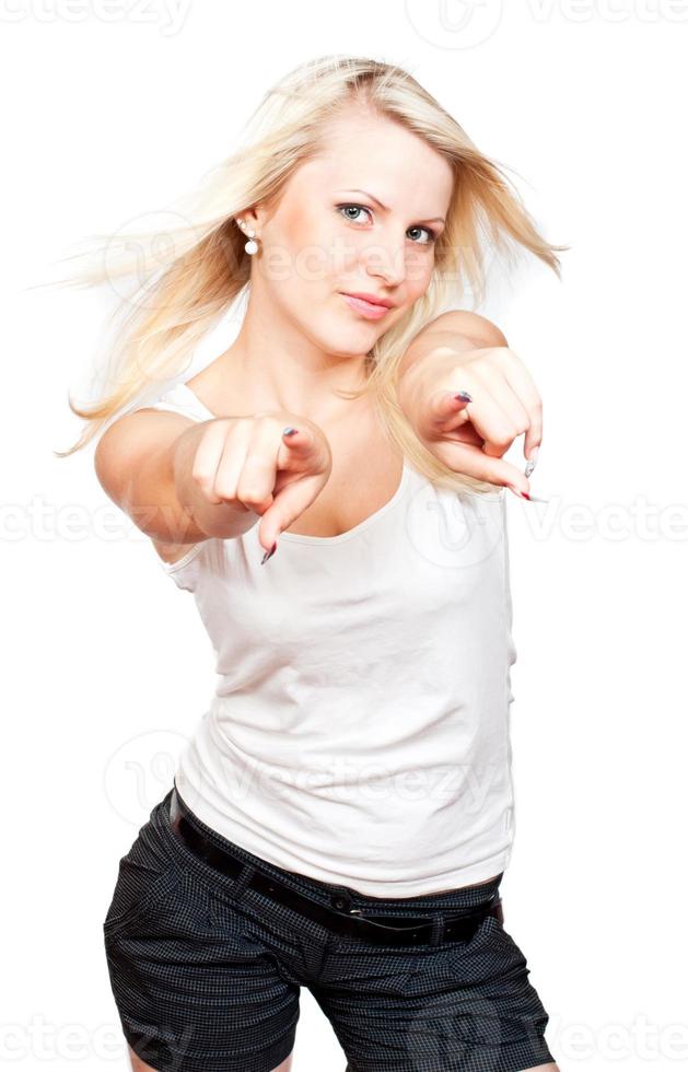 Young beautiful blonde girl pointing to you photo