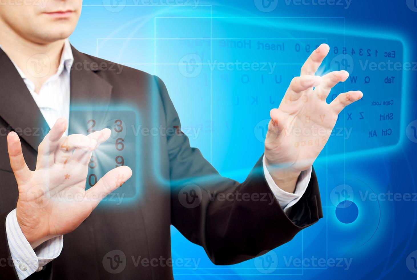 Hands pushing a button on a touch screen. photo