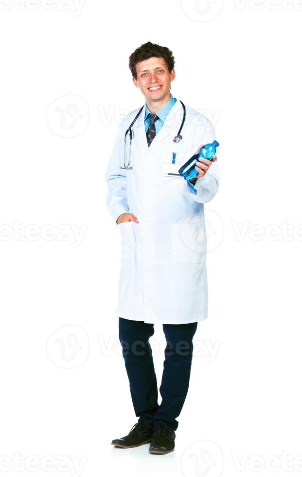 Smiling doctor holding bottle of water on white photo