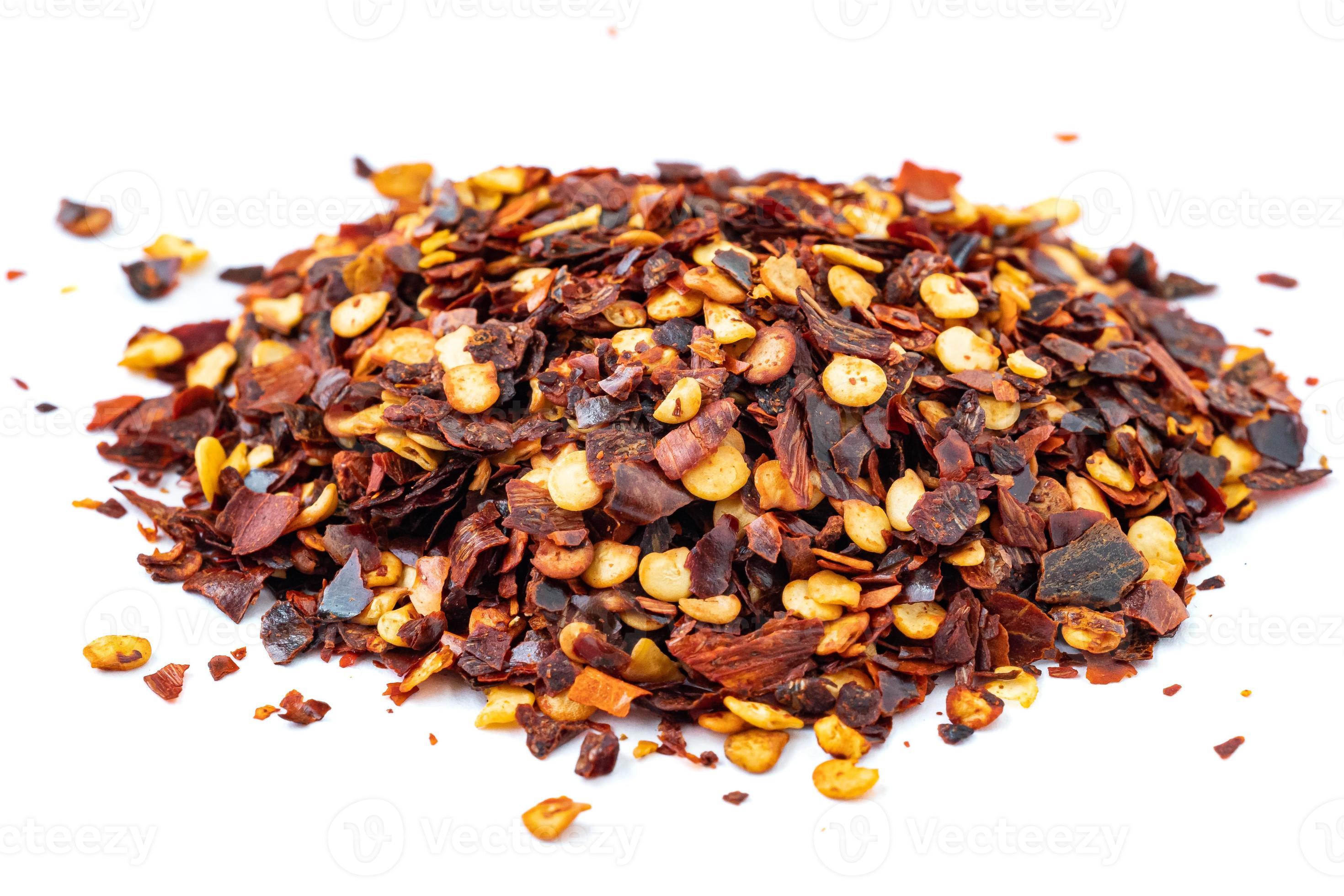 Red Pepper Flakes. Dried chili flakes and seeds isolated on white