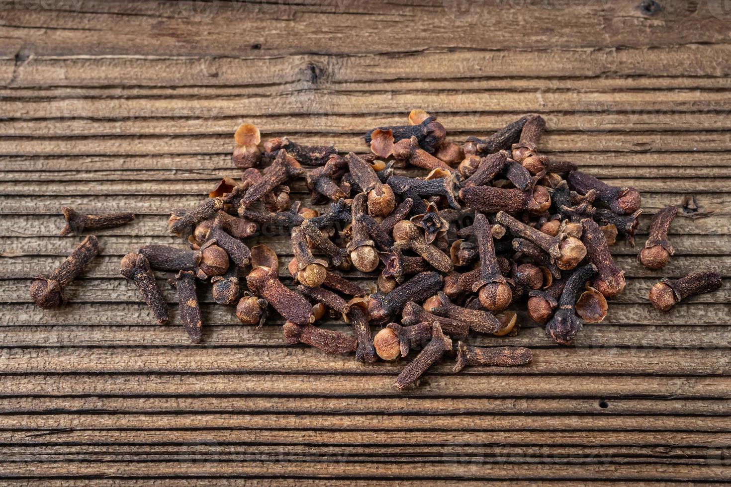 Clove spice on a wooden board, Syzygium aromaticum photo