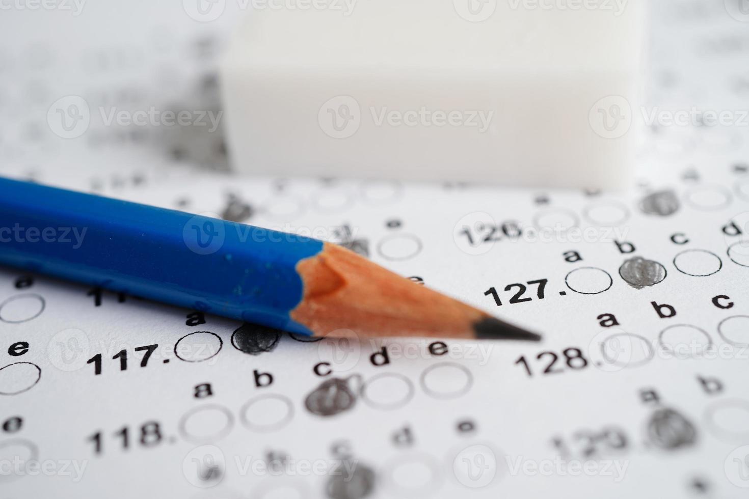 Answer sheets with pencil drawing fill to select choice, education concept. photo