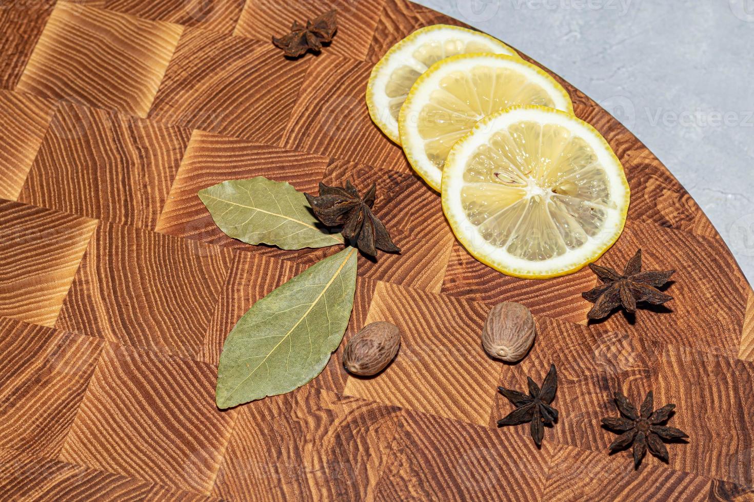 Wooden board for cutting handmade products with chopped vegetables. On a light background. photo