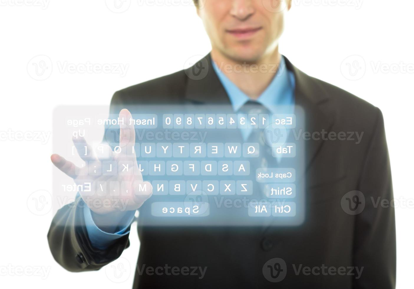 Businessman and virtual keyboard photo