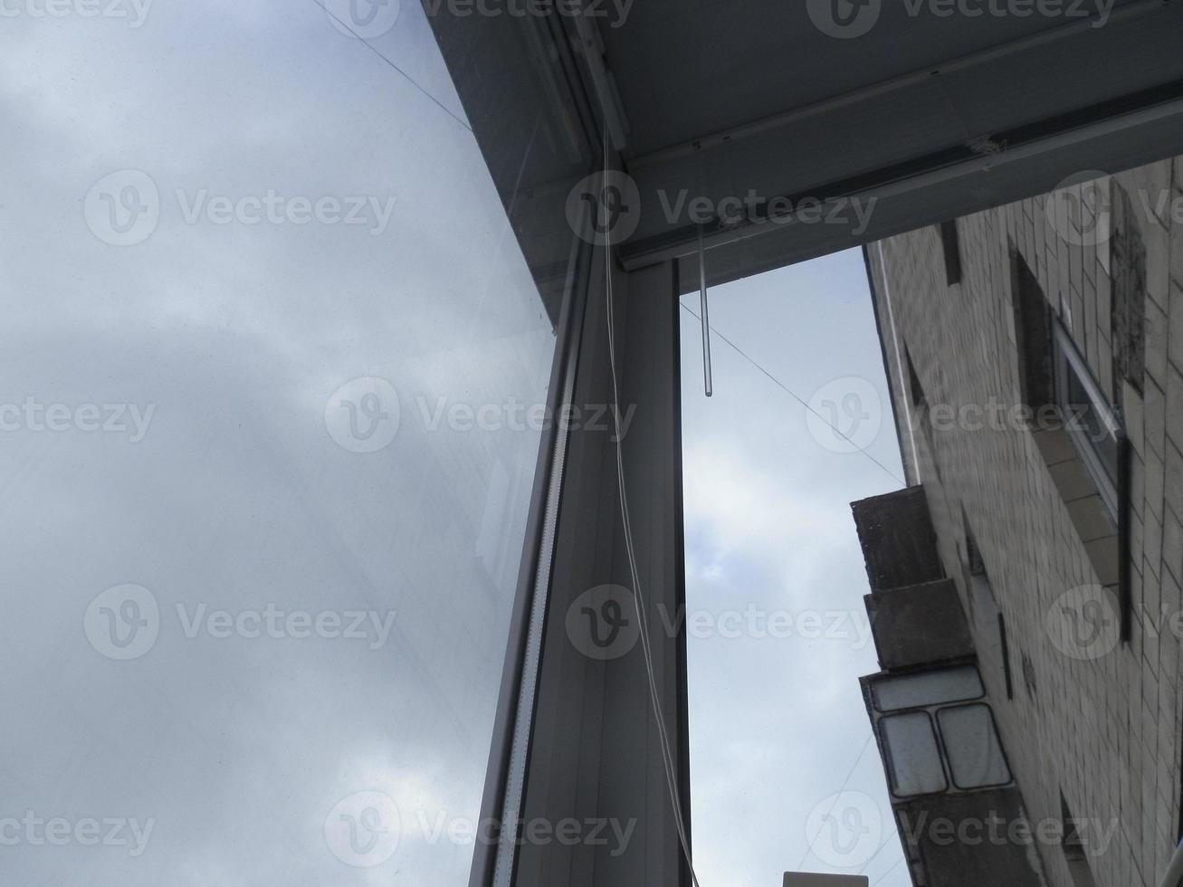 Warming and cladding with slabs of a balcony in an apartment house photo