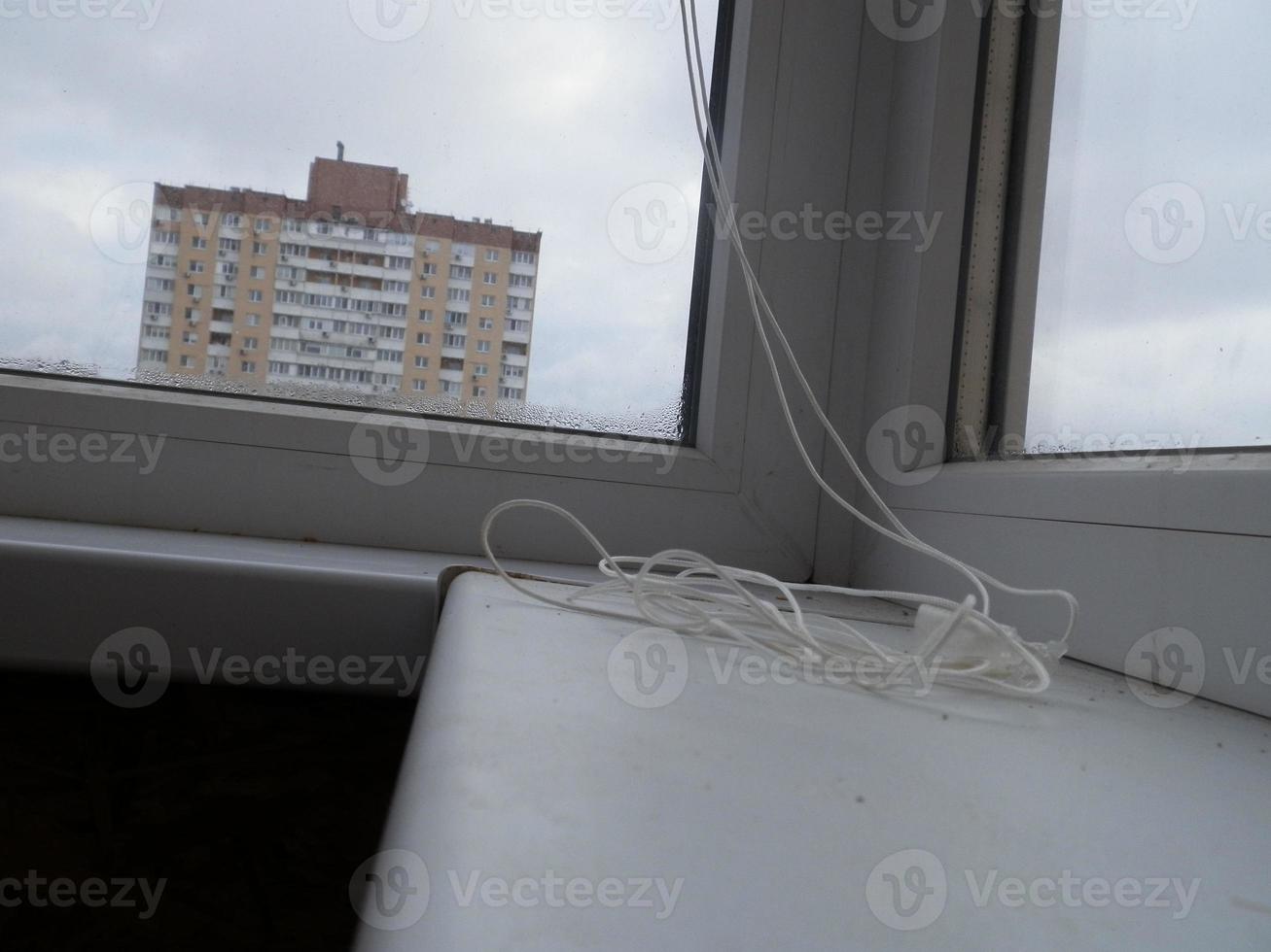 Warming and cladding with slabs of a balcony in an apartment house photo