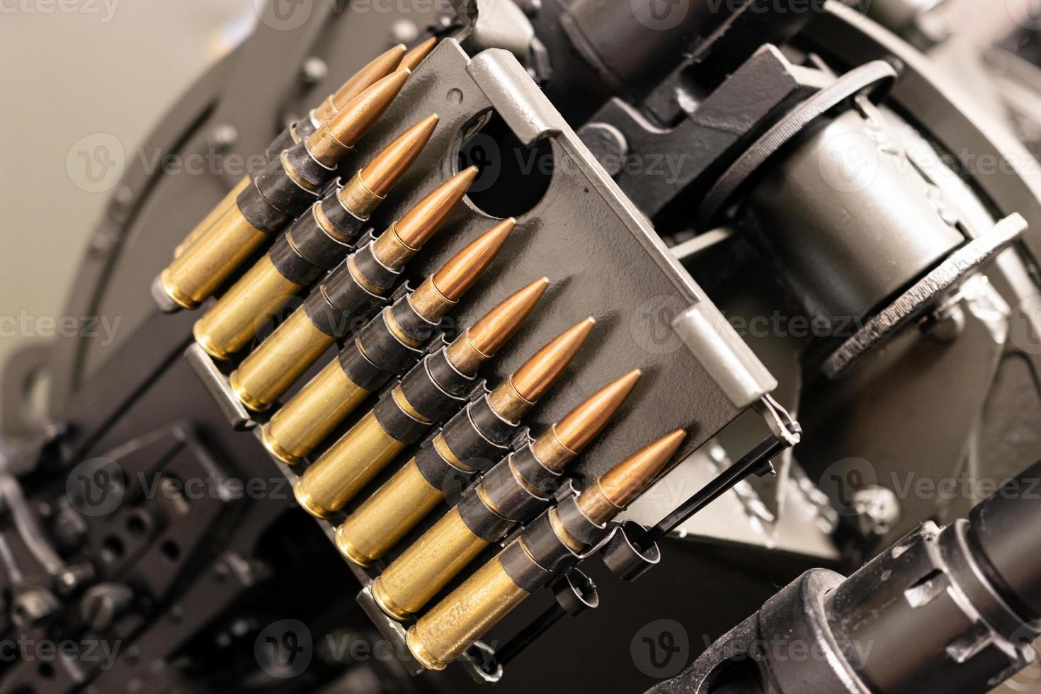 Close up of of bullets in a coaxial machine gun belt photo
