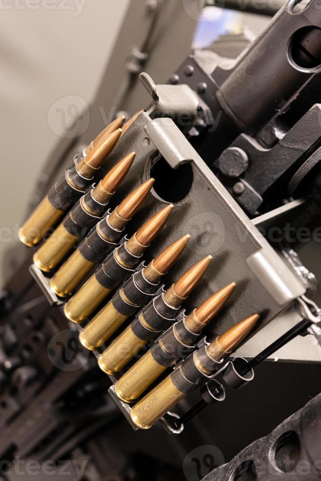 Close up of of bullets in a coaxial machine gun belt photo