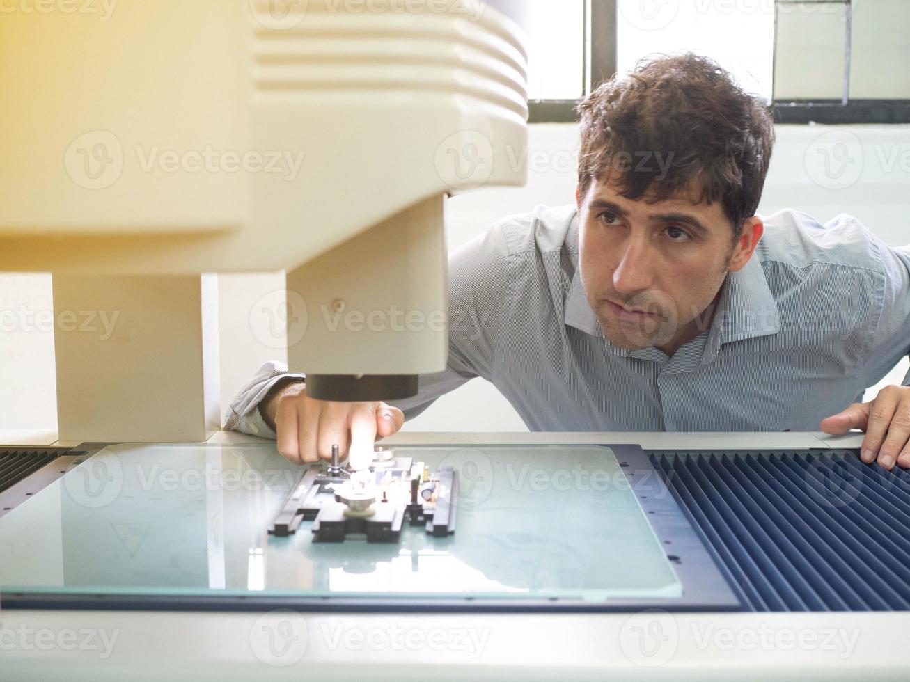Male person work job occupation researcher laboratory scientist engineer technician electronic machinery man people chemistry medical innovation future test analysis discovery genetic manufacturing photo