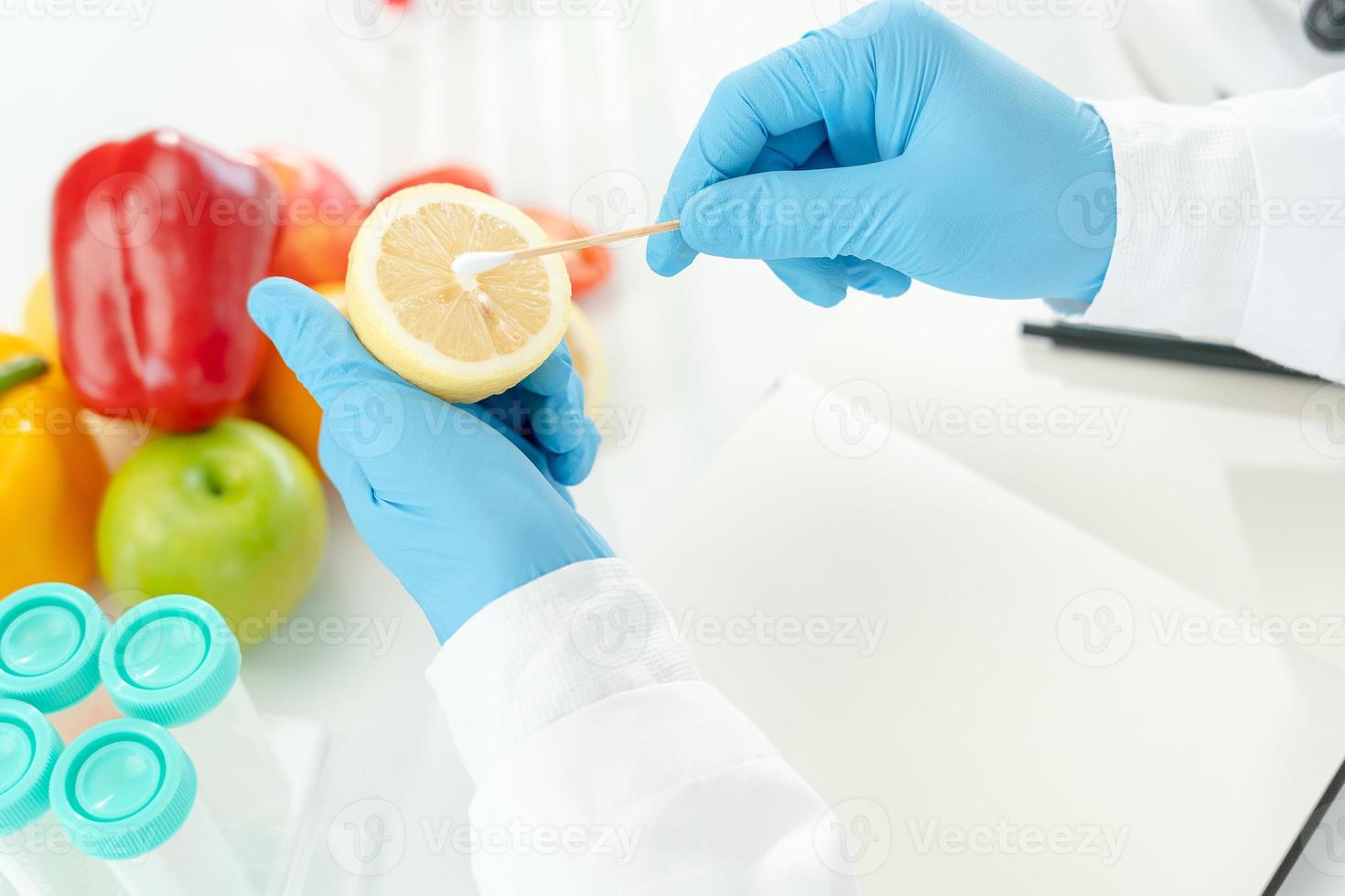 Scientist check chemical food residues in laboratory. Control experts inspect quality of fruits, vegetables. lab, hazards, ROHs, find prohibited substances, contaminate, Microscope, Microbiologist photo