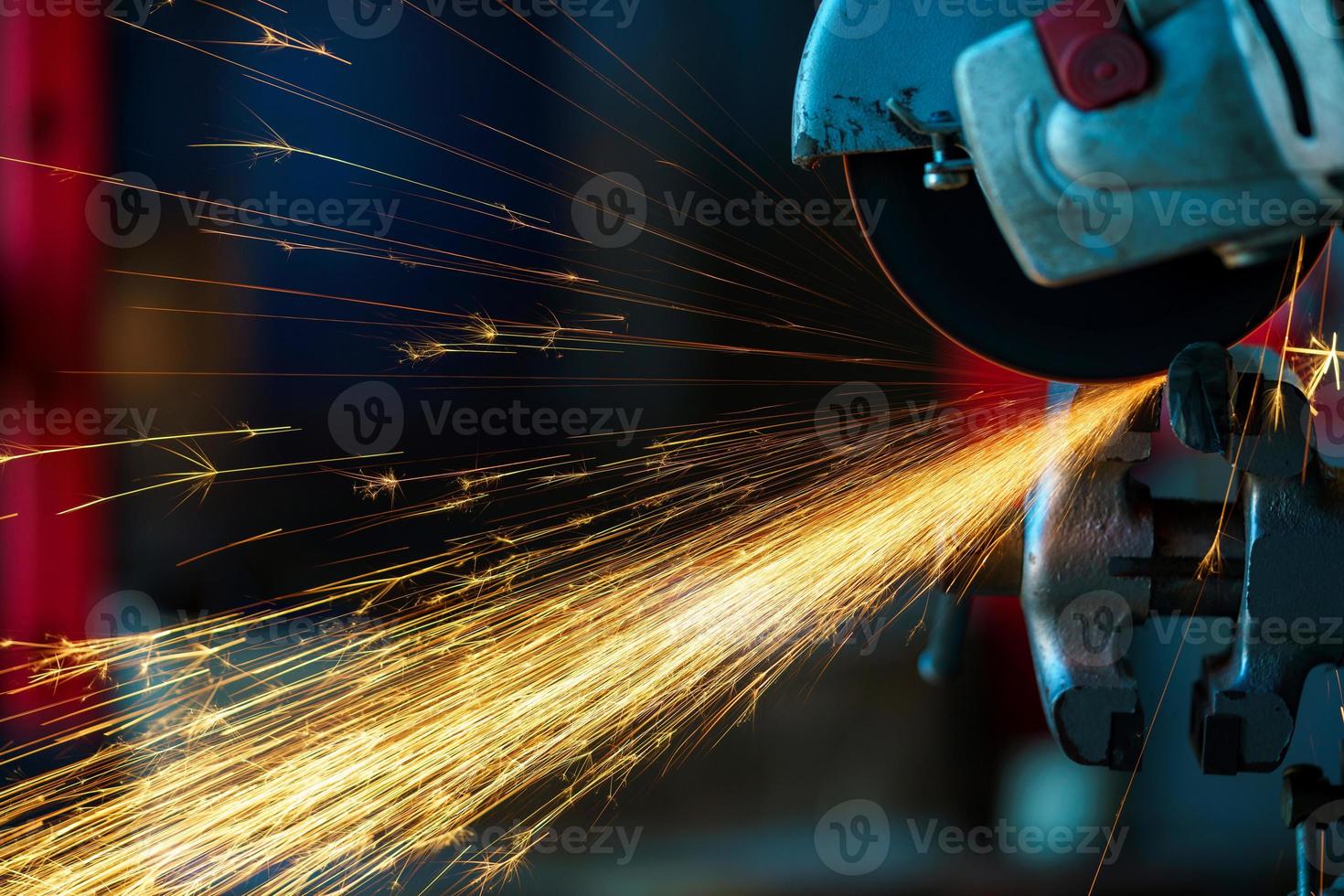 Angular grinding machine is cutting the metal photo