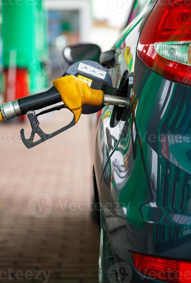 Car refueling on a petrol station close up photo