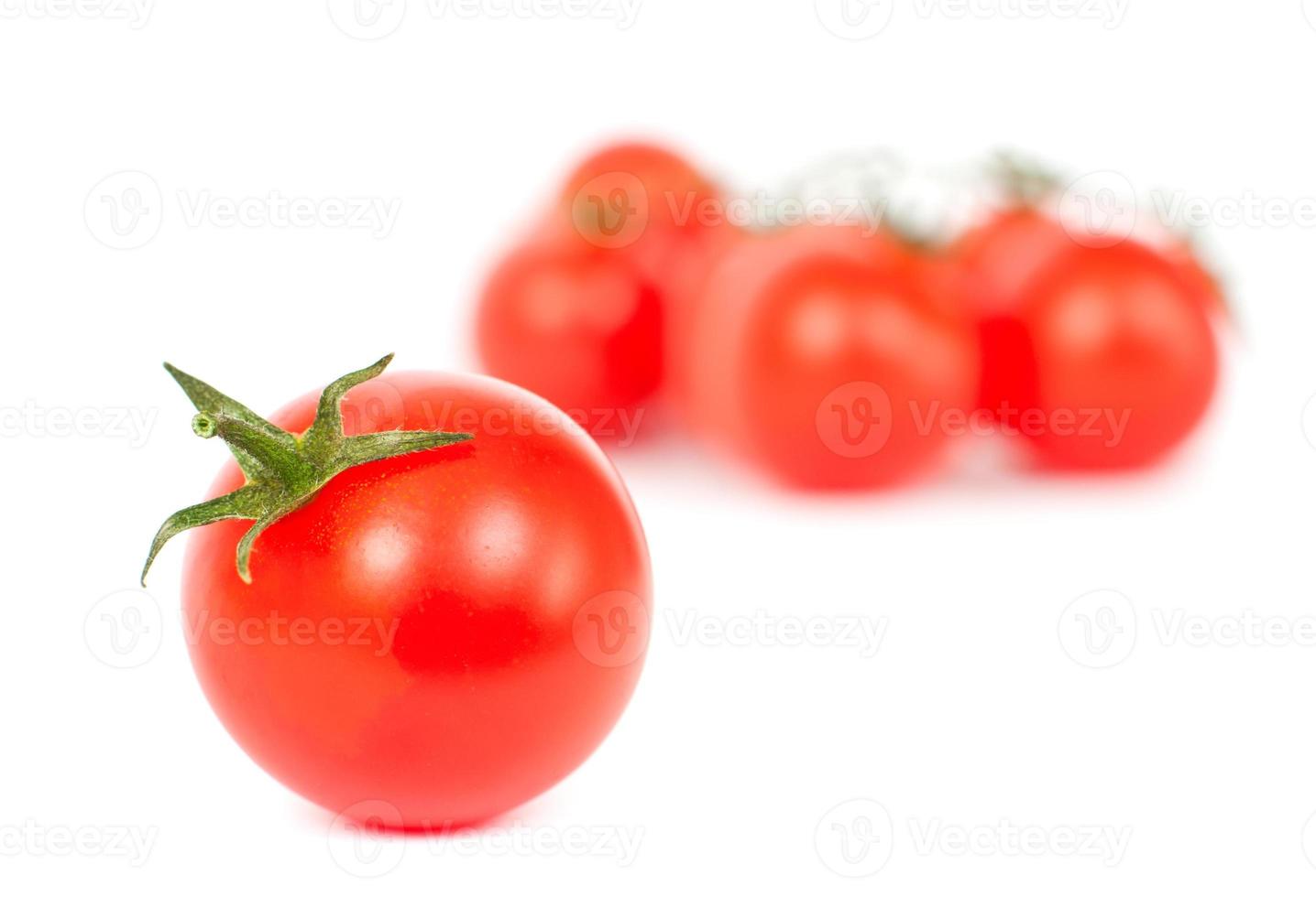 Tomatoes on a white photo