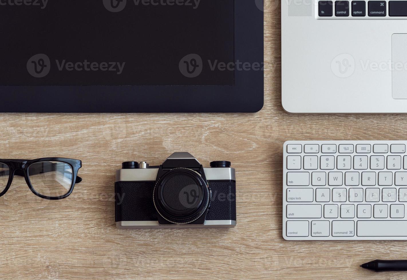 Business workplace with laptop and gadgets on wooden background photo