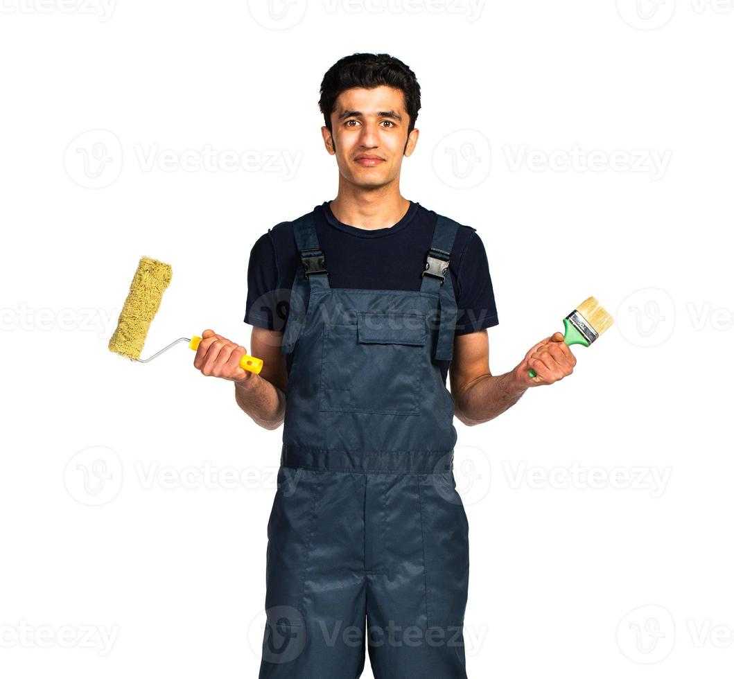 Repairman Arab nationality in the construction overalls on a white photo