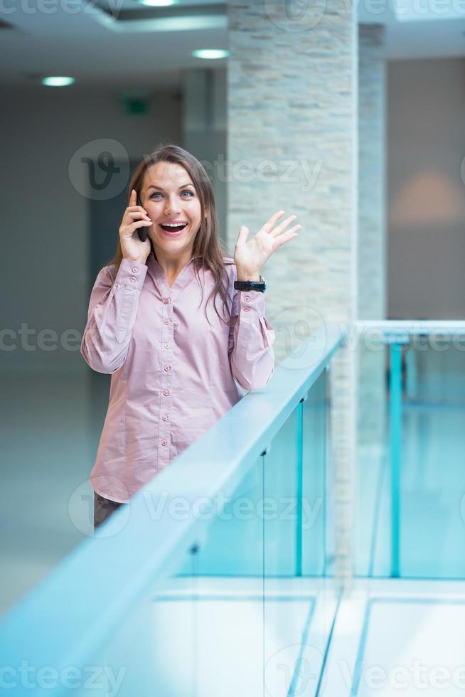 Smiling businesswoman talking on the phone photo