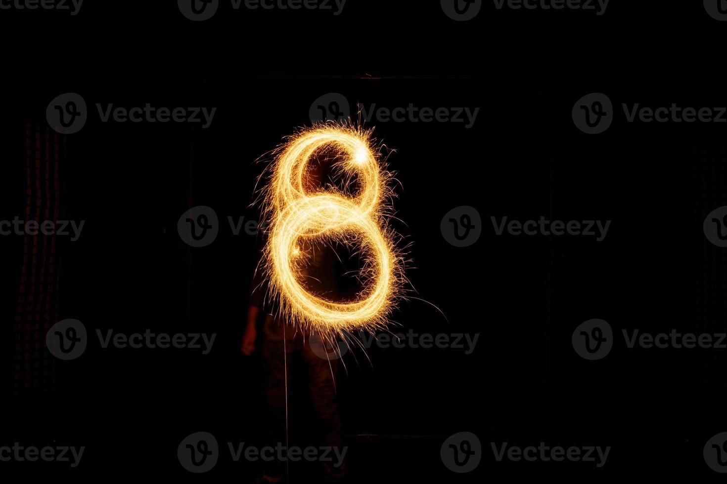 Number made with sparklers ready for your inscriptions on black background photo