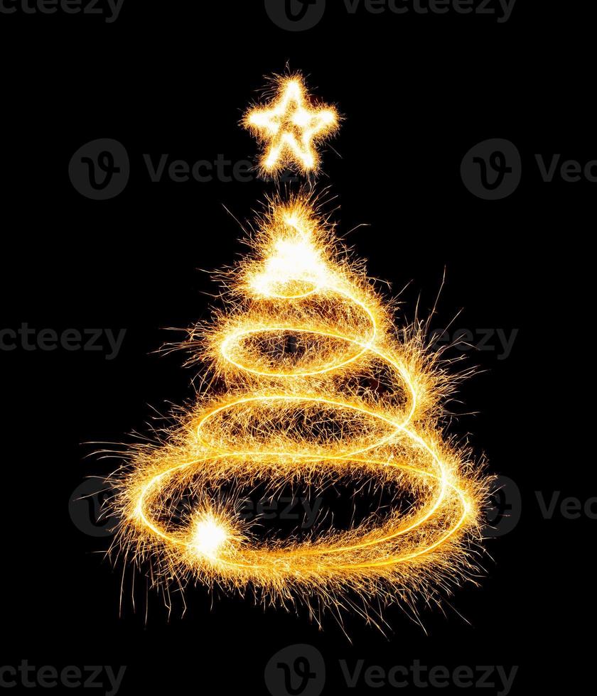 Christmas tree made by sparkler on a black photo