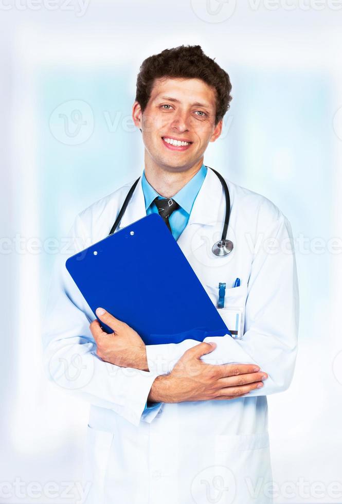 Portrait of the smiling doctor in interior photo