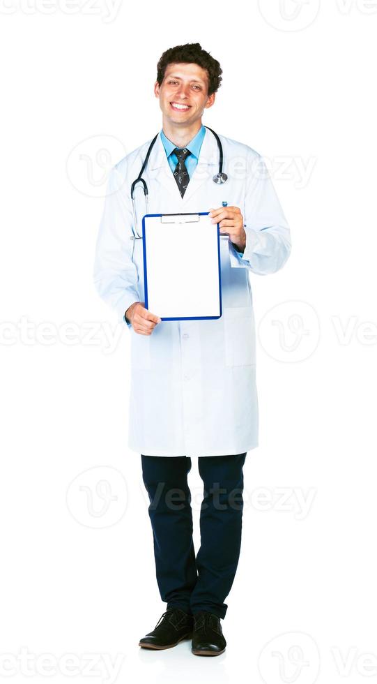 Young smiling male doctor showing clipboard with copy space for text on white photo