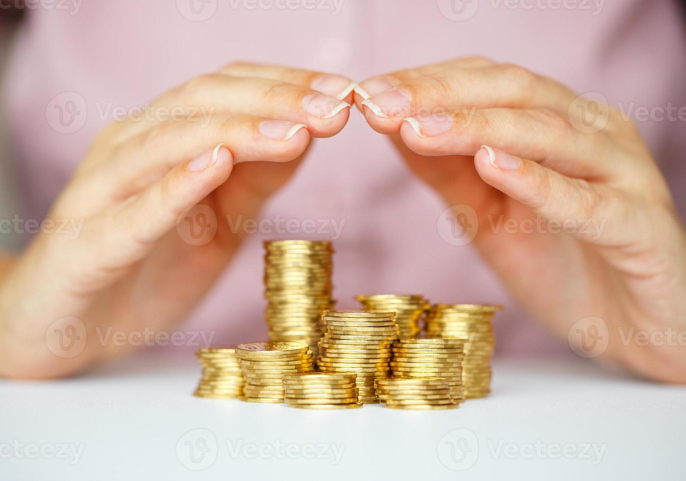 Protect new business start-up concept with hands and coin photo