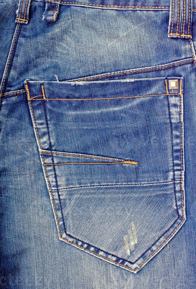 Fragment of jeans with pocket. photo