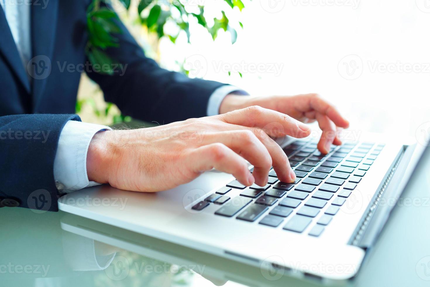 Men office worker typing on the keyboard photo