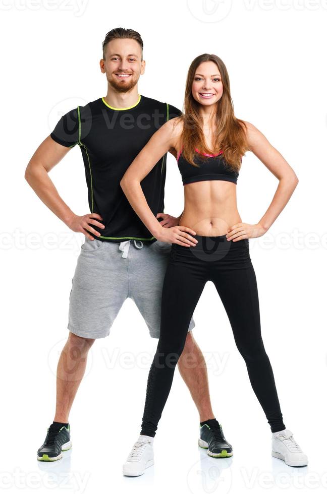 Athletic man and woman after fitness exercise on the white photo