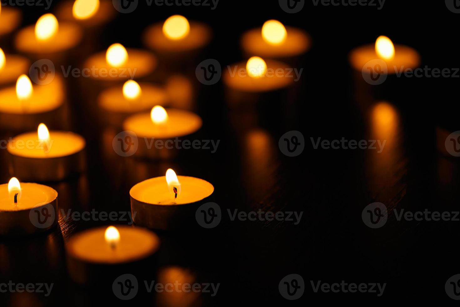 Many burning candles with shallow depth of field photo