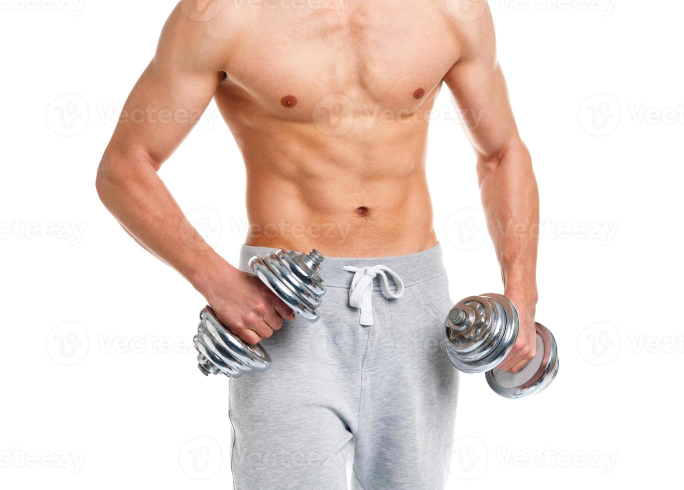 Sport man with dumbbells on the white photo