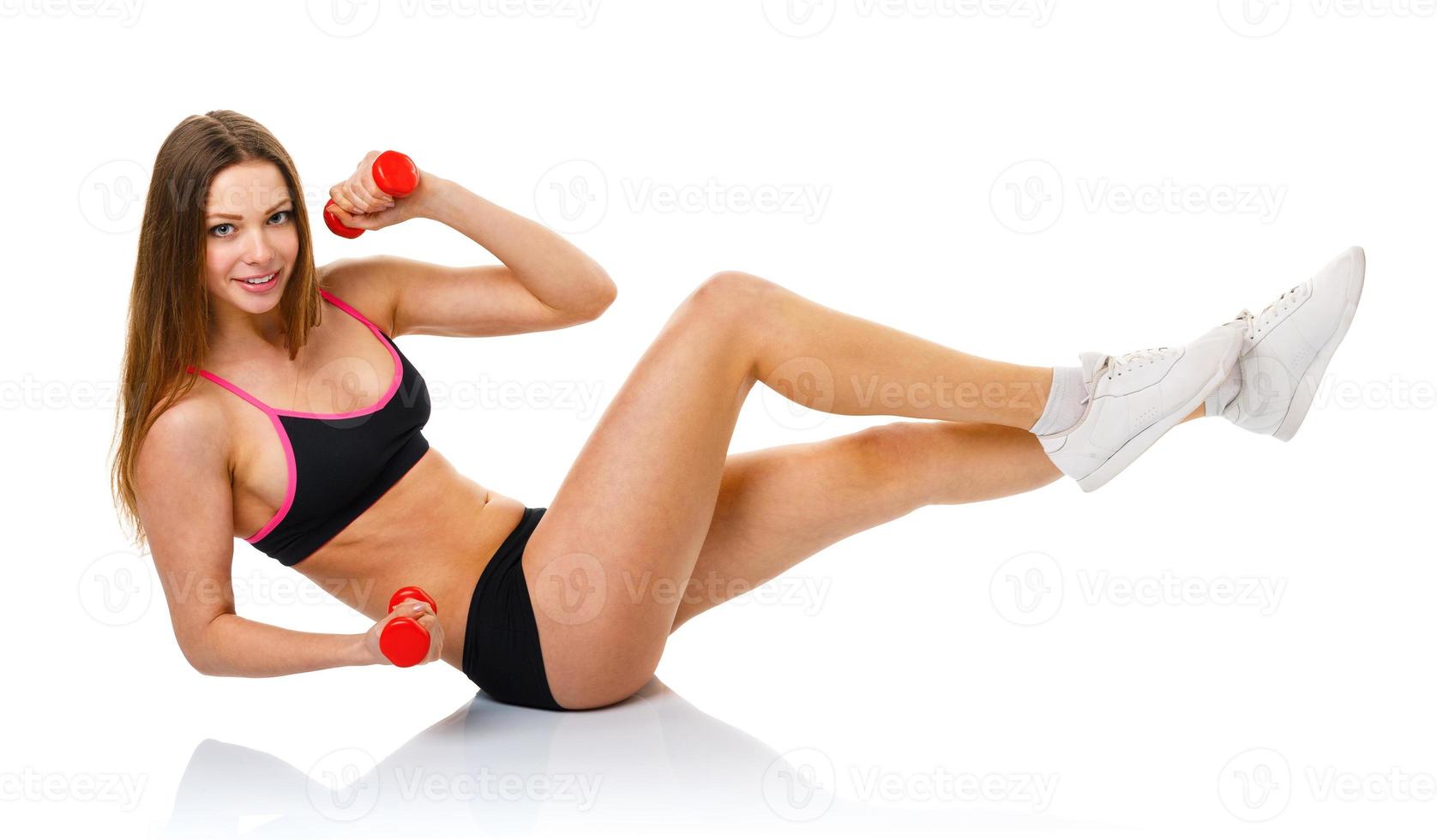 Beautiful sport woman with dumbbells doing sport exercise, isolated on white photo