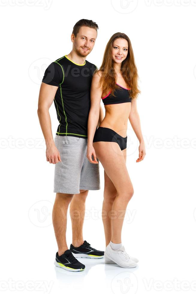 Athletic man and woman after fitness exercise on the white photo