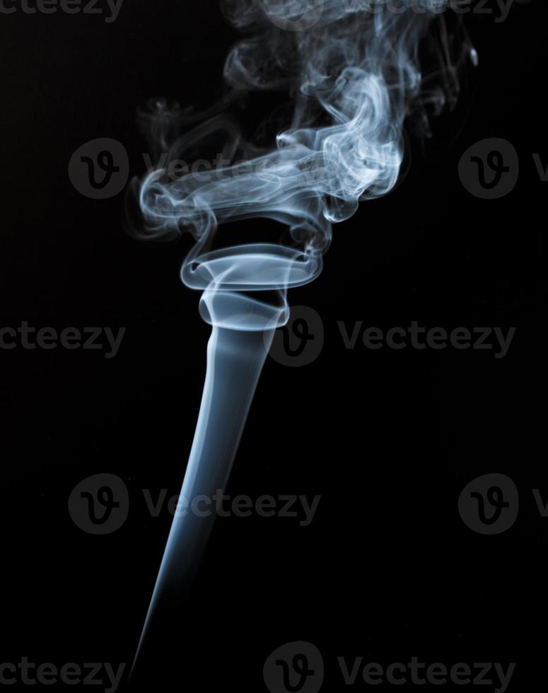 Abstract light smoke on dark background photo