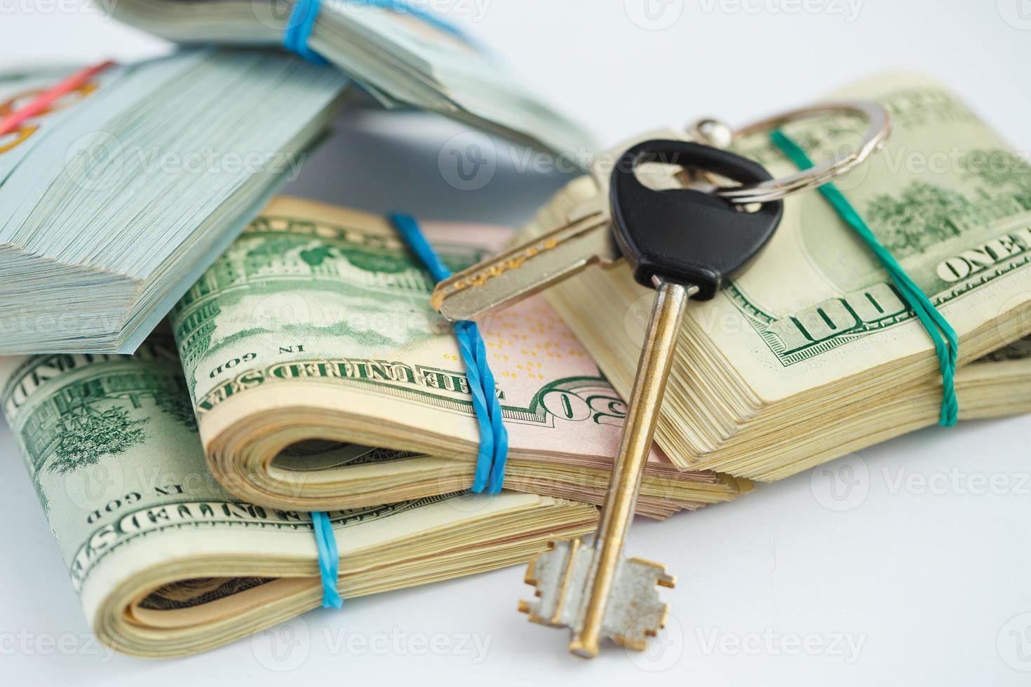 Success and got profit from business with pile of American dollars with keys photo