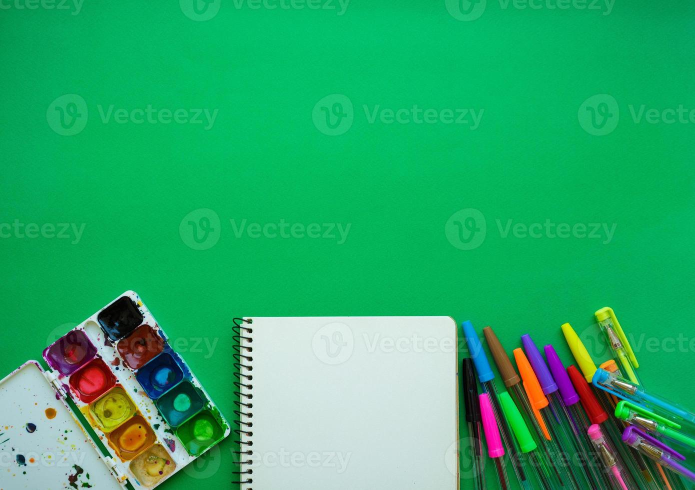 School supplies on blackboard background ready for your design photo
