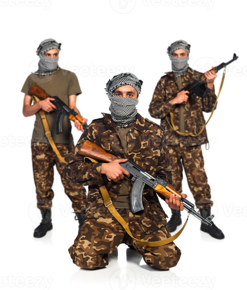 Arabs with automatic gun on white background photo