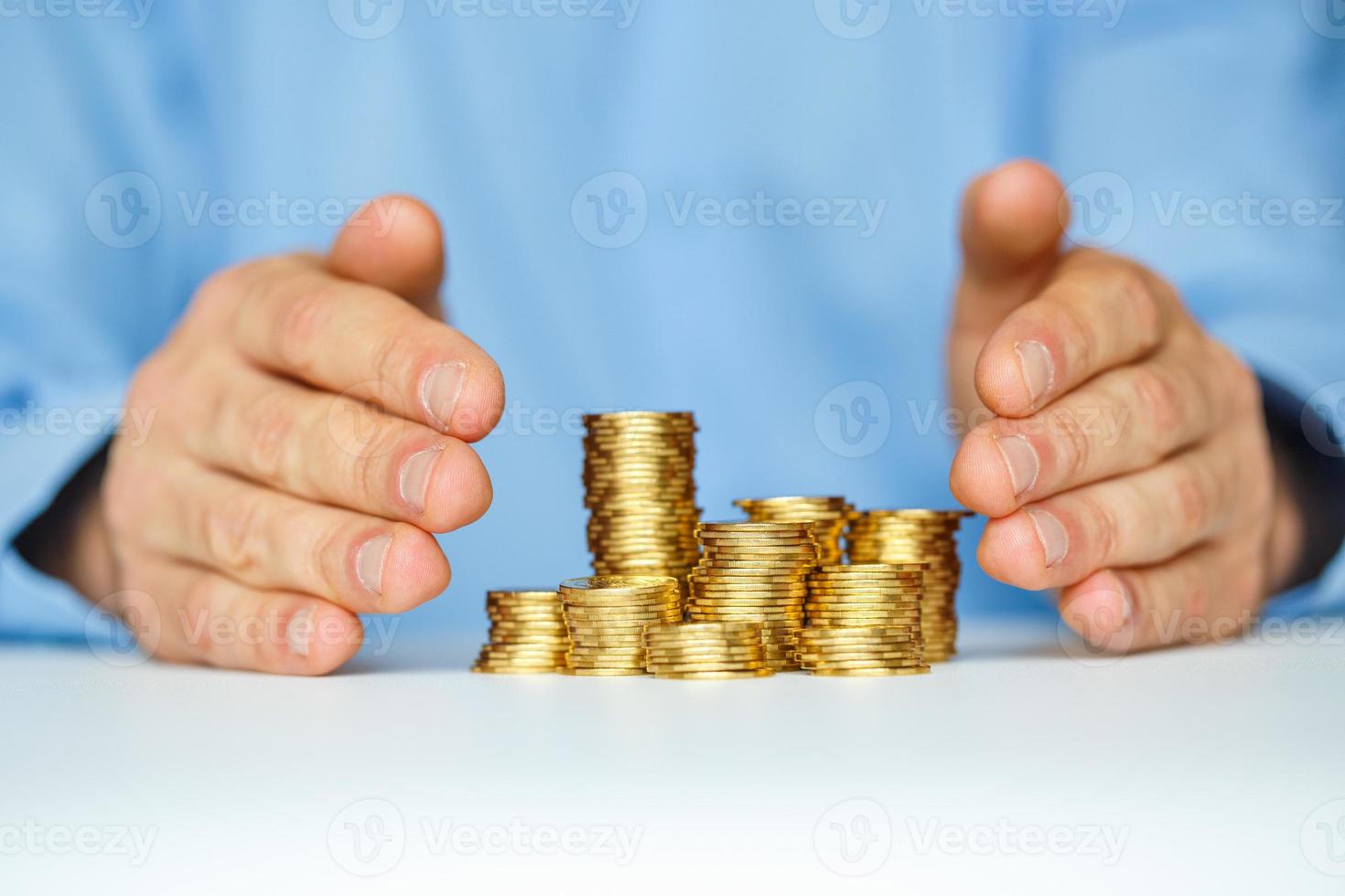 Protect new business start-up concept with hands and coin photo