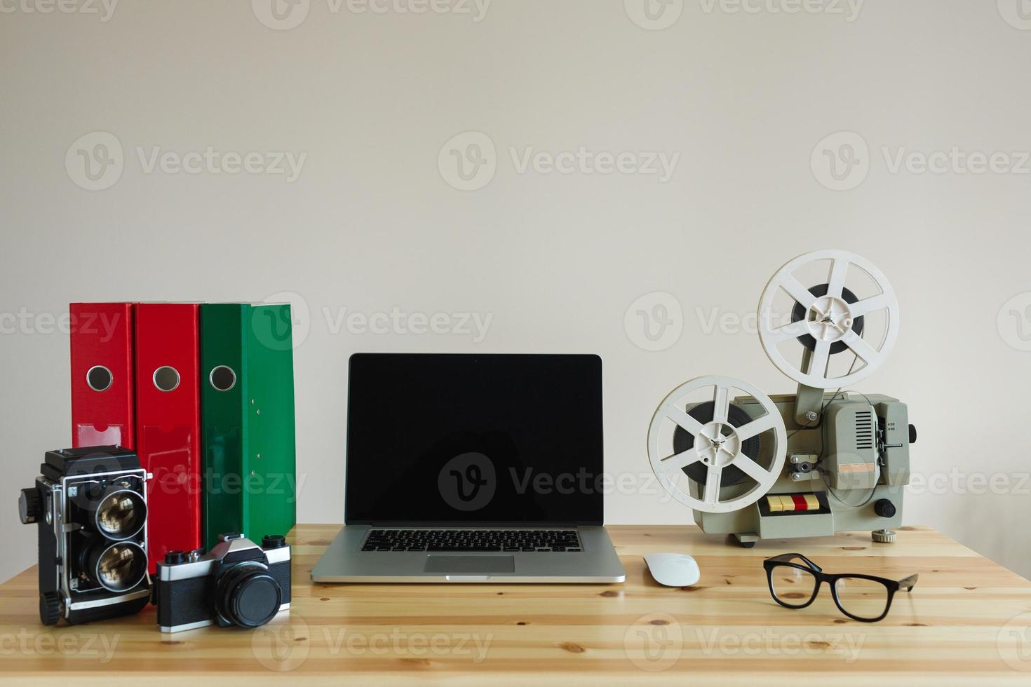 Business workplace with laptop and retro objects on wooden table photo