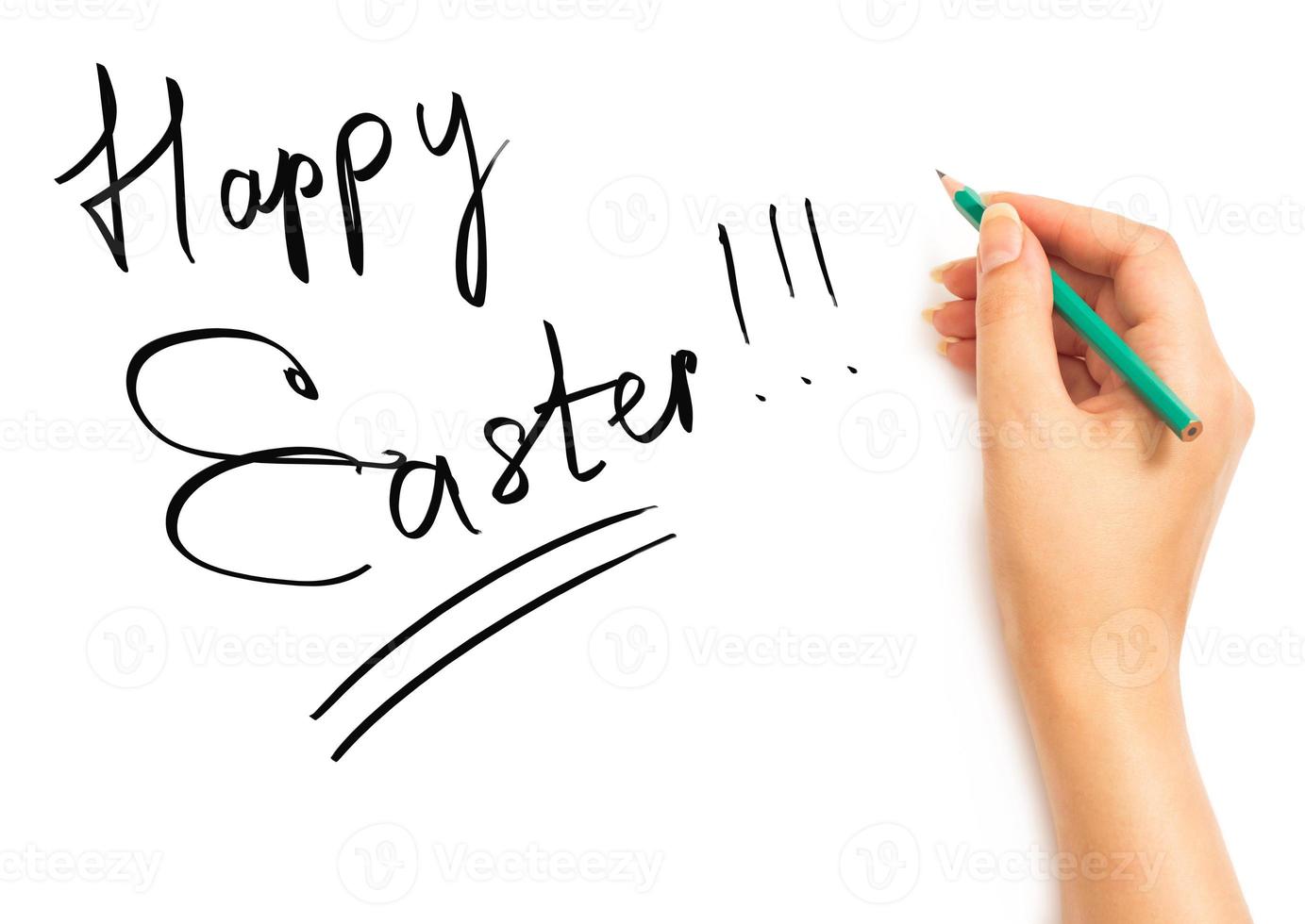 Woman's hand holding a pencil and writing Happy Easter photo