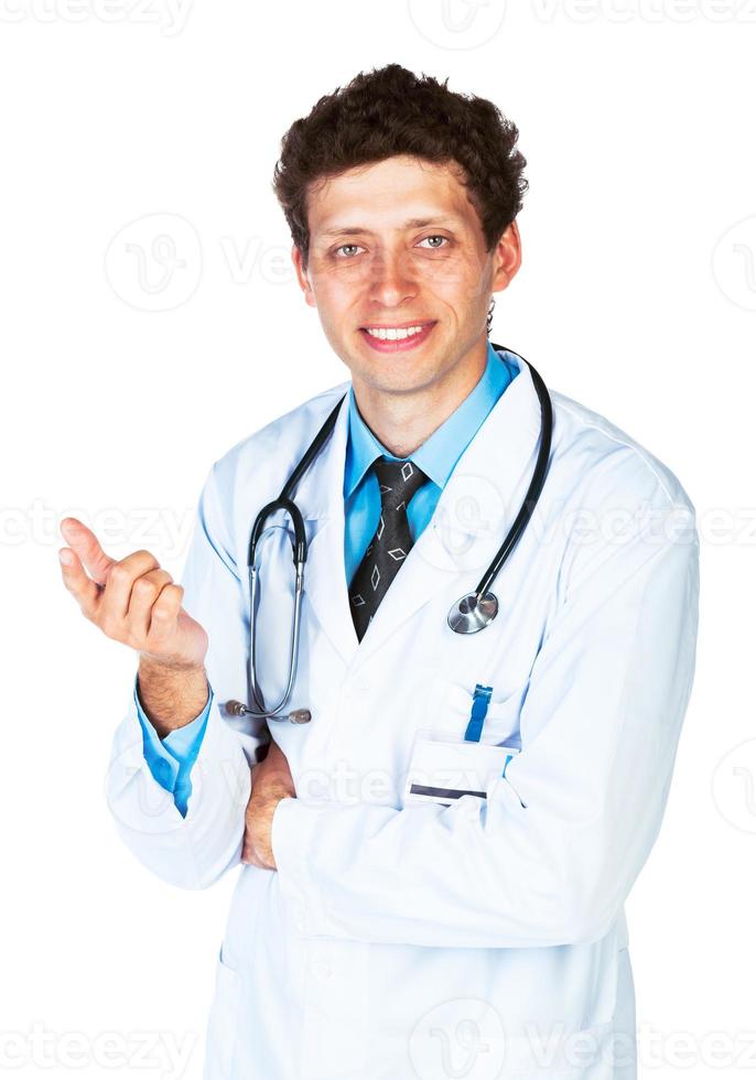 retrato de un masculino médico demostración dedo a usted en blanco foto