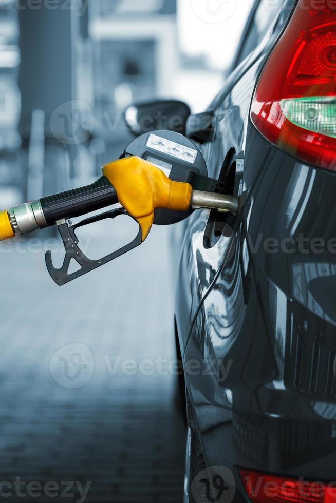 Car refueling on a petrol station photo