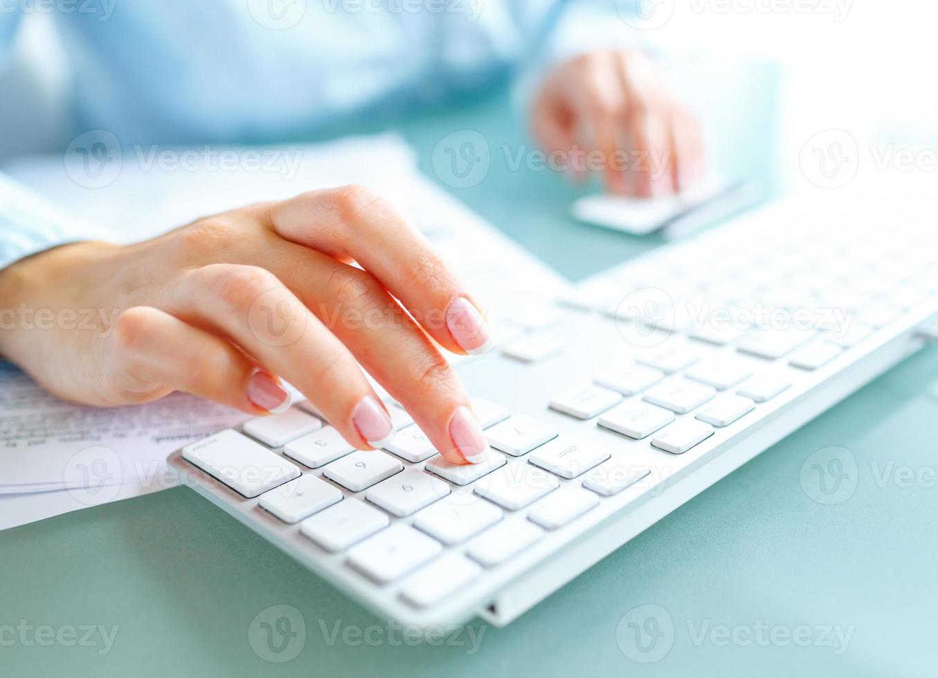 Hands using computer and credit card photo